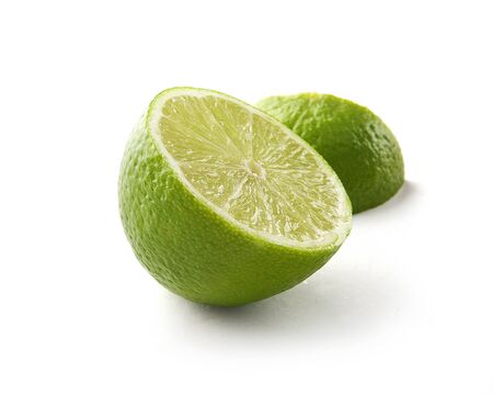 Fresh green piece of lime on the white
