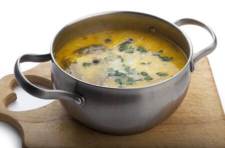 Chicken soup with cheese in the pot