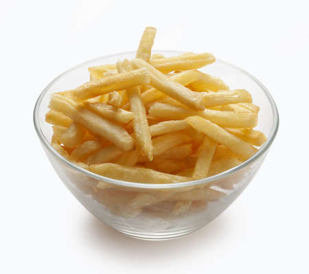 Handful of potato fries in the glass bowl