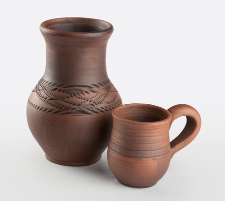 Isolated clay jug and mug on the white backgroundの写真素材
