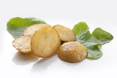 Some fried potato with fresh green lettuceの写真素材