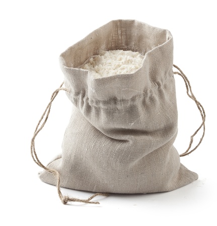 Isolated small sack with white flour on the white backgroundの写真素材