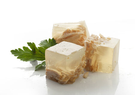 Three cube of chicken galantine with green parsley