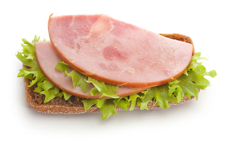 Sandwich with ham, green freshh lettuce and rye bread on the whiteの写真素材