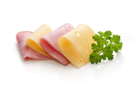 Folded cheese and ham with fresh green parsleyの写真素材