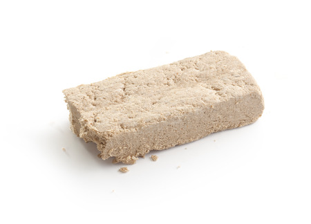 Isolated brick of halva on the white background