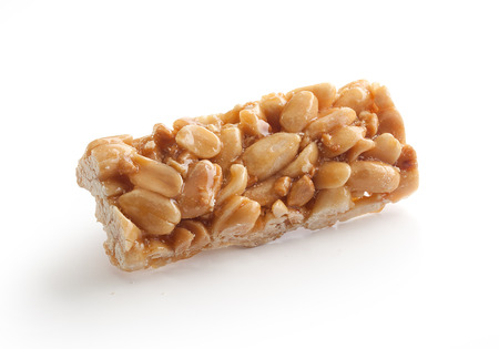 Isolated peanut brittles brick on the white backgroundの写真素材