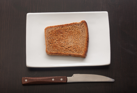 Top view of toasted rye bread on the white plateの写真素材