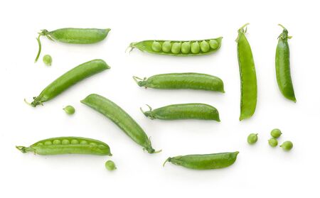 To view of fresh green pea pods and peas on the white backgroundの写真素材