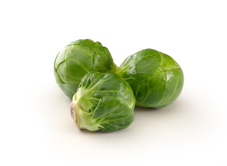 Handful of fresh green brussels sprouts on the whiteの写真素材