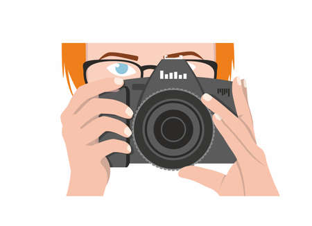 A girl photographer with orange hair, blue eyes holds a black camera and looks forward. Vector drawing of a woman photojournalistのイラスト素材