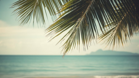 Tropical summer seascape with palm leaves, beach and paradise ocean. Vacation and travel backdrop. Generative AI.の素材