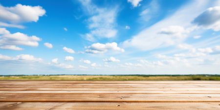 Wood table mockup with blue cloudy sky background. Empty copy space for product presentation. Generative AI.の素材