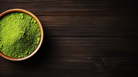 Matcha tea powder in a wooden plate on dark background with whisk, top view, copy space. Generative AI.の素材