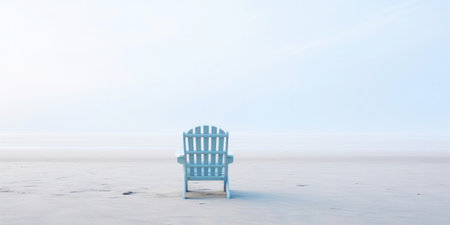 Lonely chair on white sand of tranquil beach of sea covered with mist. Generative AI.の素材