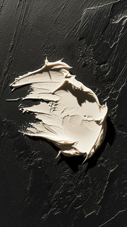 Aesthetic rough smear of face cream or white paint with detailed texture. Dark background with sun rays. Generative AI.の素材