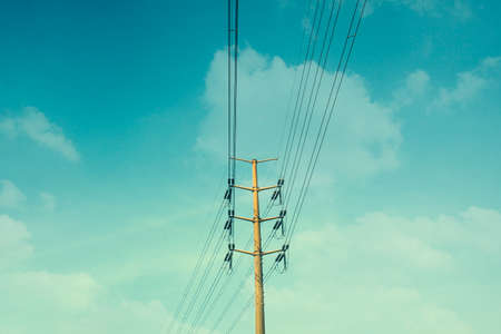 Electric Poles with cloudy skyの写真素材