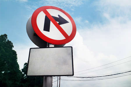 traffic sign board no turning right with a blank board underneathの写真素材