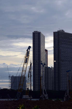 Outdoor photography of Construction works with Skyscraper Buildings background at afternoonの写真素材