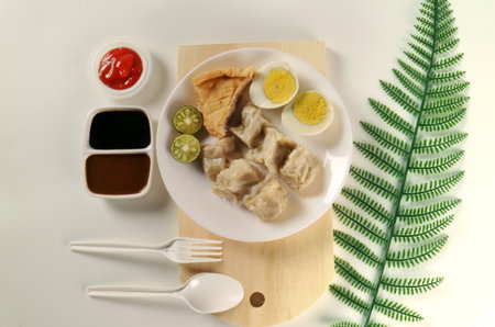 Steamed Dumplings with Egg and Dipping Sauces