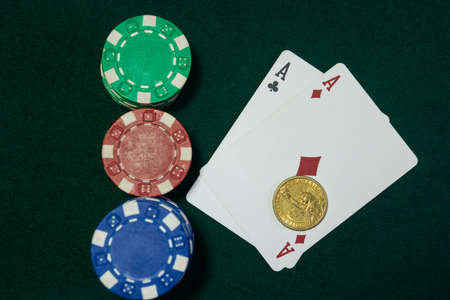 Two aces under the Golden dollar. A textured background.Copy paste place.