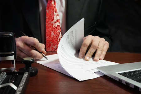 A businessman's signature on the contractの写真素材