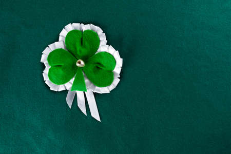Clover leaf on a green baize.の写真素材