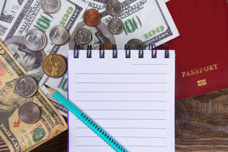 Dollars and passport. Notepad to plan. Copy paste