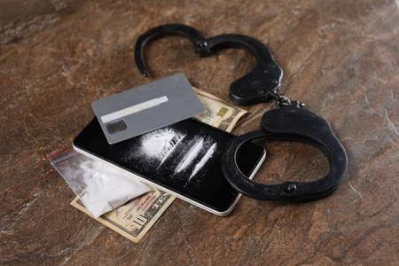 Illegal drugs, money and handcuffs. Copy paste