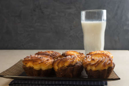 Chocolate cheesecake cupcakes and a glass of milk for Breakfast. Copy spase.の写真素材