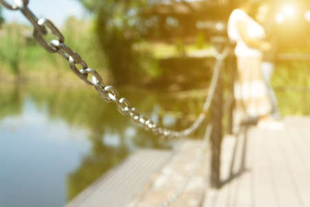 The chain is locked. The exit from the pier to the water is closed. Safety for life.の写真素材