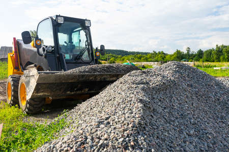 The loader picked up rubble in the bucket for construction work.