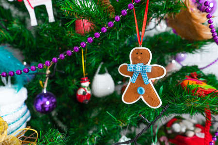Gingerbread decorated Christmas tree dressed with garlands and toys. Copy pasteの写真素材