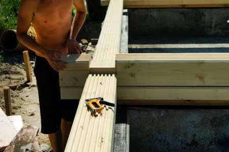 Construction of a wooden house made of profiled laminated veneer lumber.の写真素材