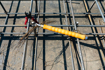 Tie rebar beam cage on construction site. Steel reinforcing bar for reinforced concrete