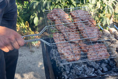 Barbecue on the grill. Cooking meat on the grillの写真素材