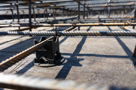 Tie rebar beam cage on construction site. Steel reinforcing bar for reinforced concreteの写真素材