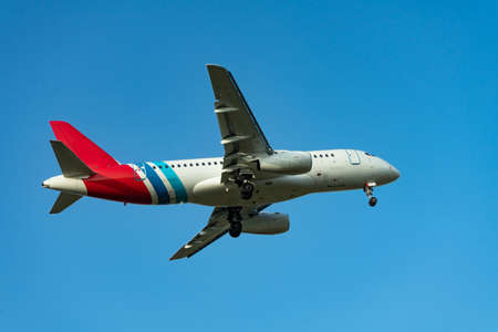Place flying in sunset sky. Passenger plane on a background of the sky.の写真素材