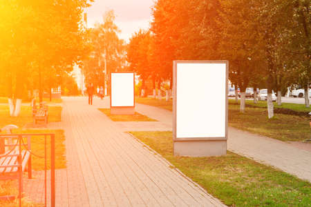Blank billboard outdoors, outdoor advertising, public information board on city streets. Copy space. Mock upの写真素材