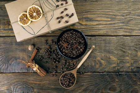 Coffee beans in a container, cinnamon, nutmeg and clovesの写真素材
