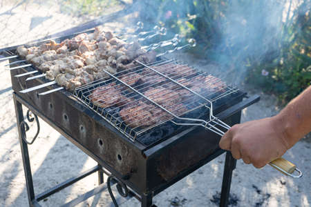 Barbecue on the grill. Cooking meat on the grillの写真素材