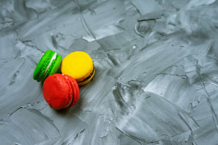 Sweet macaroons on stone background with copy space. Top view,