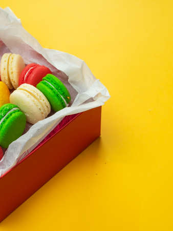 Colorful macaroons. Sweet macaroons on color background with copy space.の写真素材