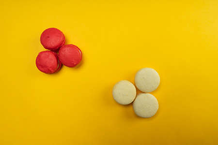 Colorful macaroons on a yellow background. Concept for the holidayの写真素材
