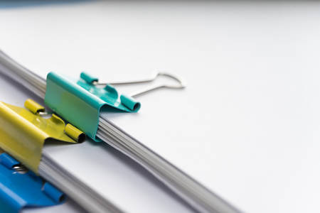 Mock up, stack of papers documents in archives files with paper clips on desk at offices, business concept. Copy space.の写真素材