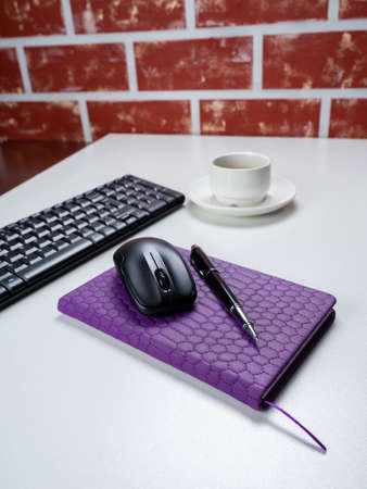 Office table desk. Workspace with note book, keyboard, office supplies and coffee cup on white...
