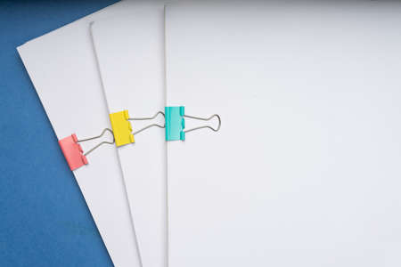 Mock up, stack of papers documents in archives files with paper clips on desk at offices, business...