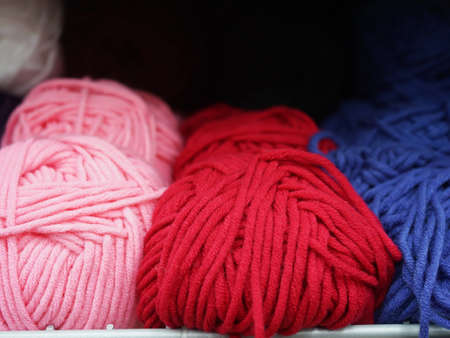 Skeins of thread in the store on the shelf
