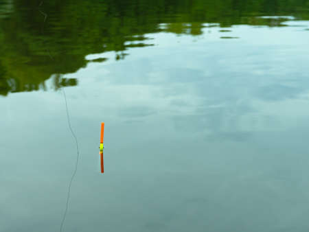 Fishing float on the water. Fishing with a float rodの写真素材