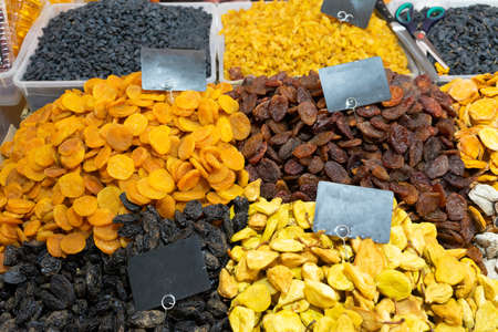 A variety of dried fruits are on the counter.の写真素材